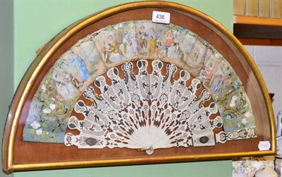 Lot 438 - A 19th century ivory fan in a glazed case