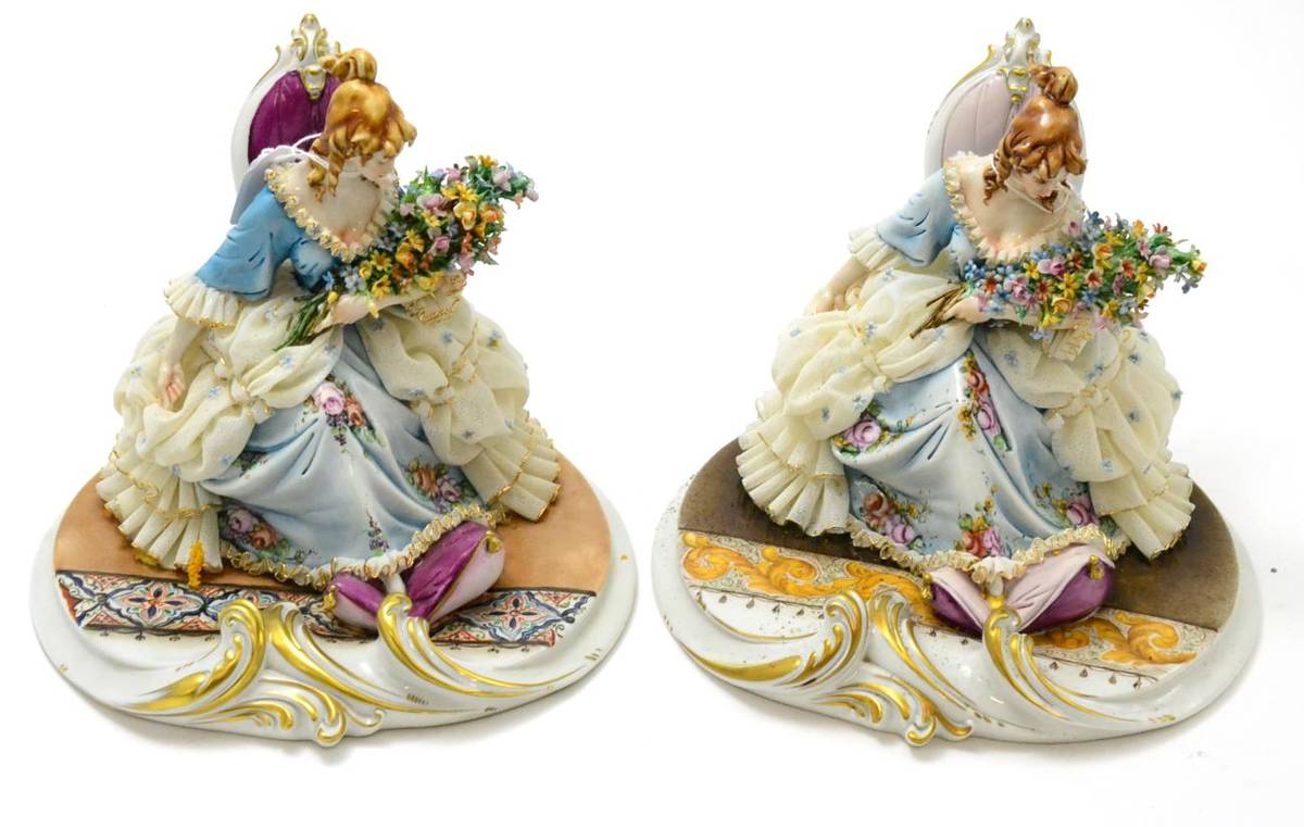 Lot 458 - Two similar Capodimonte figures of seated ladies in 18th century dress