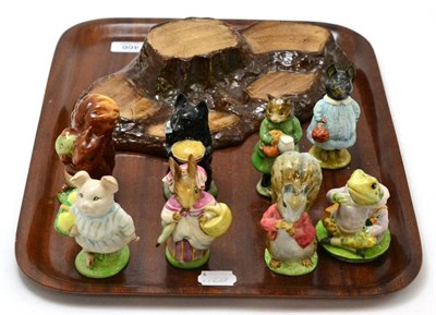 Lot 466 - Beswick Beatrix Potter figures comprising: Mrs Rabbit, Little Pig Robinson, Timmy Tiptoes, Squirrel