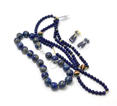 Lot 478 - A lapis lazuli bead necklace with ear pendants, two lapis lazuli necklaces with cloisonne beads and