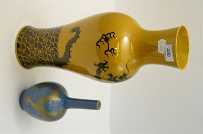 Lot 489 - A Chinese mustard glazed baluster vase decorated with dragons and a small Chinese bottle vase...