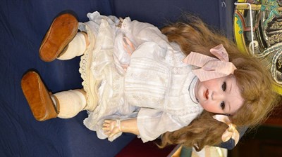 Lot 502 - A German Ernst Heubach bisque socket head character doll, impressed '267.9', with brown wig worn in