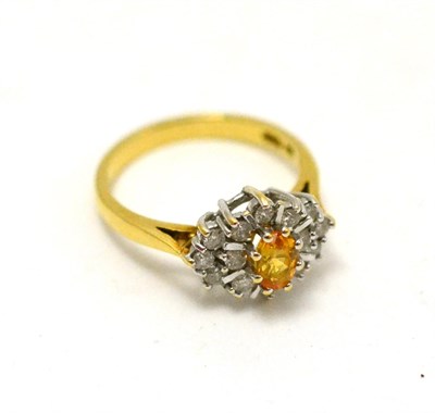 Lot 522 - A citrine and diamond cluster ring