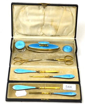 Lot 544 - Blue enamel and silver mounted manicure set in a black leather fitted hinged case