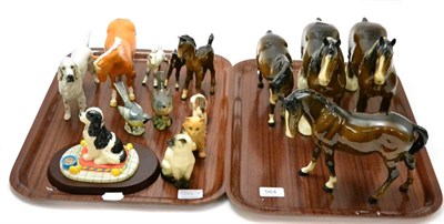 Lot 564 - A collection of Beswick animals including two bay shires, palamino pony, foals etc together...