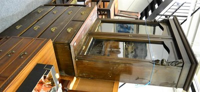 Lot 1012 - Late Victorian bookcase on four height chest of drawers