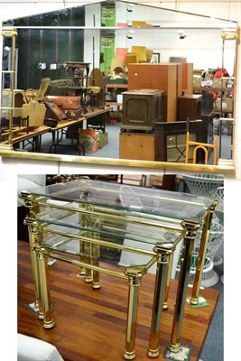 Lot 1016 - Modern nest of three glass and brass occasional tables and a modern gilt mounted wall mirror