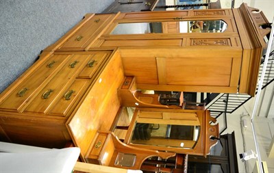 Lot 1017 - A wardrobe and dressing table