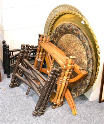 Lot 1032 - Four Eastern folding stands with brass, copper and decorative tray tops