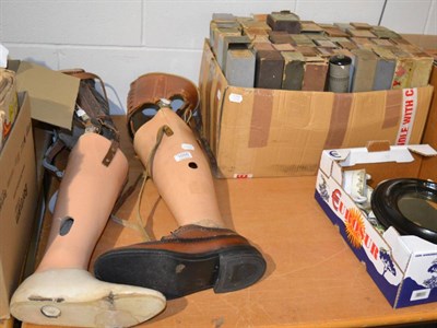 Lot 1055 - Two prosthetic legs and pianola music rolls