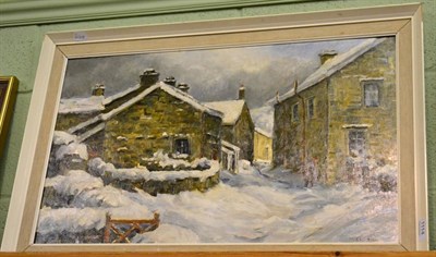 Lot 1114 - M. Cooper, A dales village under heavy snow, oil on board, 40cm by 67cm, framed