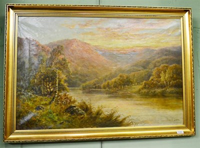 Lot 1149 - An oil on canvas picture signed Charles Leader, depicting a river landscape