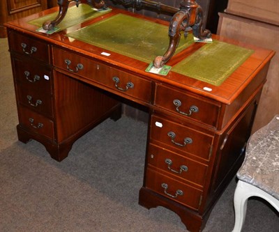 Lot 1187 - A reproduction yewwood pedestal desk