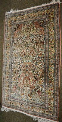 Lot 1190 - A Chinese silk prayer rug, the ivory field centred by a Tree of Life surrounded by birds...