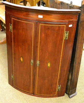 Lot 1191 - A checkered string inlaid mahogany hanging corner cupboard