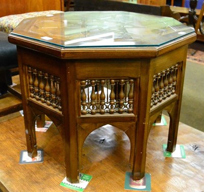 Lot 1192 - Eastern style octagonal shaped occasional table with carved spindles and glass mount