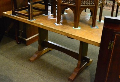 Lot 1193 - An English joined oak refectory style dining table, with adzed top and trestle platform base joined