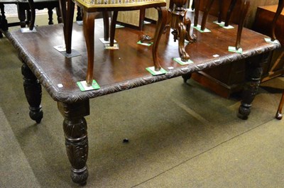 Lot 1195 - A carved oak Victorian dining table with leaf and winder