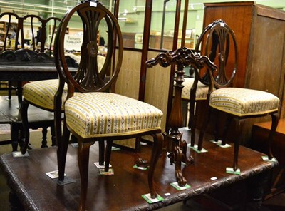 Lot 1197 - A set of four Edwardian salon chairs with ribbon tied crestings to the back