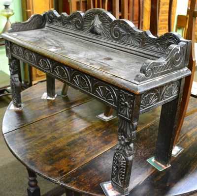 Lot 1202 - Victorian carved oak hall seat