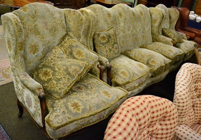 Lot 1222 - A three piece suite comprising a three seater wing back settee and a pair of armchairs