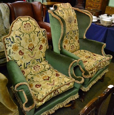 Lot 1226 - A Jacobean style wing armchair and another similarly upholstered (2)