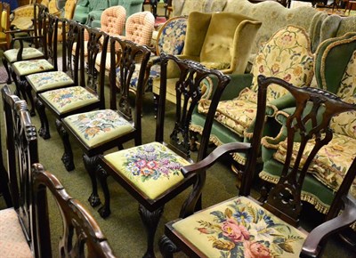 Lot 1227 - A set of Georgian style mahogany dining chairs with carved back splats and claw and ball feet (6+2)