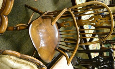 Lot 1229 - A reproduction oak Windsor armchair with dished seat and crinoline stretcher