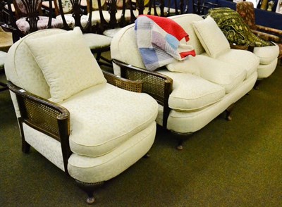 Lot 1234 - Three piece bergere suite with modern cream upholstery and cushions