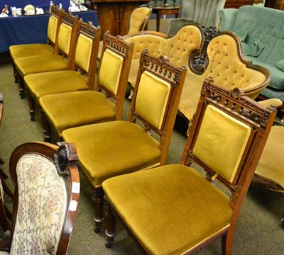 Lot 1242 - A set of six Victorian carved oak and ebony inlaid dining chairs, in the manner of C & R Light,...