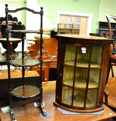 Lot 1253 - Mahogany bow-fronted corner display cabinet with nine glazed panels to door, two fixed shelves...