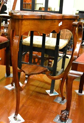 Lot 1255 - A Bijouterie table with carved and glazed hinged top with velvet lined display area