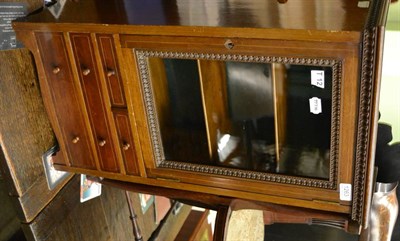 Lot 1263 - A mahogany table top display cabinet, glazed door enclosing two shelves and four drawers with...