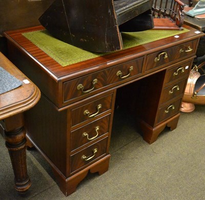 Lot 1272 - A reproduction pedestal desk with green leather top by J Sydney, Penrith