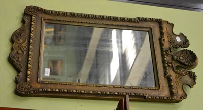 Lot 1288 - A gilt framed wall mirror with shell detail to the top