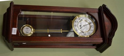 Lot 1302 - A modern quarter striking wall clock