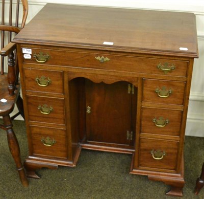 Lot 1303 - A 19th century mahogany kneehole desk