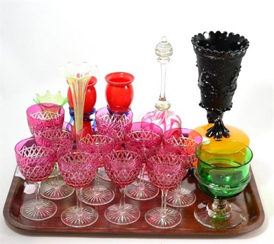 Lot 35 - A set of cranberry glasses and other coloured glassware