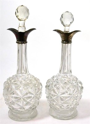 Lot 41 - A pair of silver collared decanters (2)