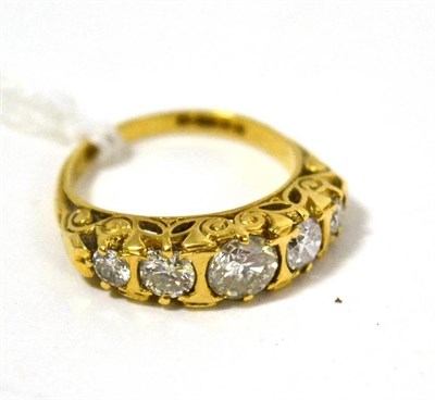 Lot 72 - An 18ct yellow gold five stone diamond carved set band ring