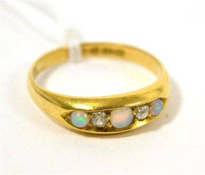 Lot 78 - An 18ct gold opal and diamond ring