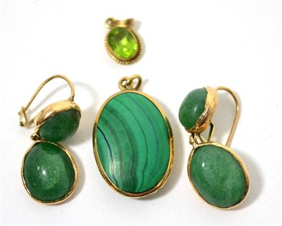 Lot 79 - A peridot pendant, pair of marcasite earrings and a malachite mount pendant