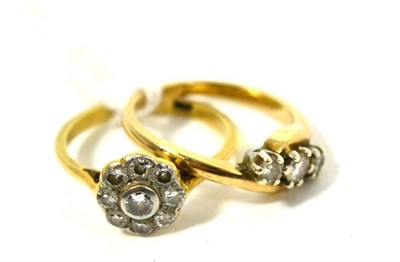 Lot 93 - A diamond cluster ring and a 9ct gold diamond three stone twist ring