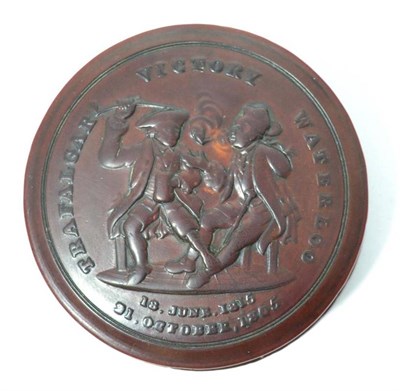 Lot 122 - A 19th century turned wooden snuff box commemorating Wellington's victory over Napoleon