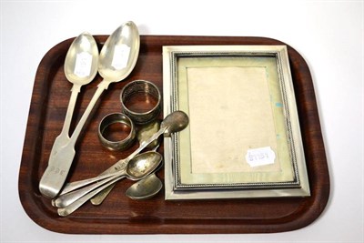 Lot 128 - A group of silver, including photograph frame, two napkin rings, caddy spoon, spoons etc