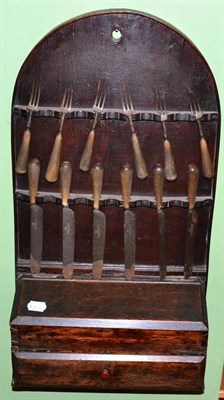 Lot 148 - A Georgian oak cutlery rack with candle box and drawer