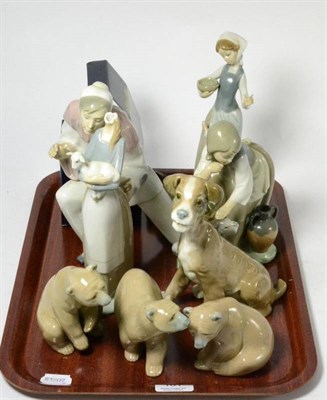 Lot 161 - Eight Lladro figurines (a.f., seven boxed) and a Caithness paperweight