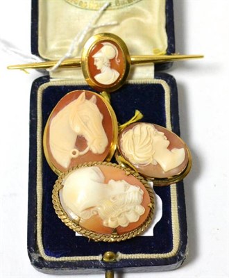 Lot 212 - A 9ct gold cameo brooch, a cameo bar brooch stamped '15CT', a horse cameo brooch/pendant and a...