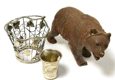 Lot 216 - A Russian silver tot, a Georgian silver pierced basket and a Black Forest bear