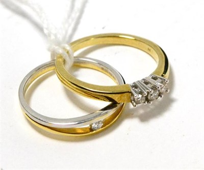 Lot 226 - A 9ct gold diamond three stone ring and an 18ct two colour gold diamond solitaire ring